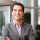 Happy young businessman smiling at the office Happy young businessman smiling at the office